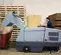 Gray Nilfisk ride-on scrubber